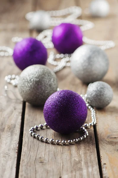 Christmas ornament with balls on the wooden table