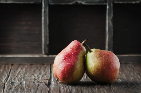 Red sweet pears on  table