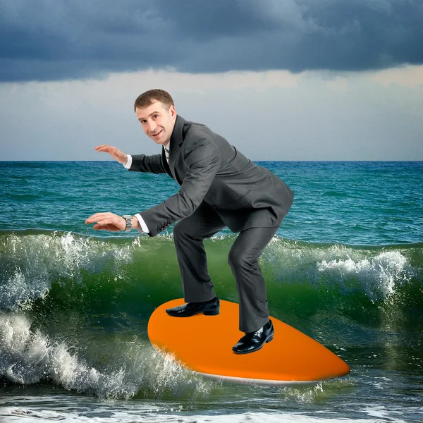 Businessman on surfboard