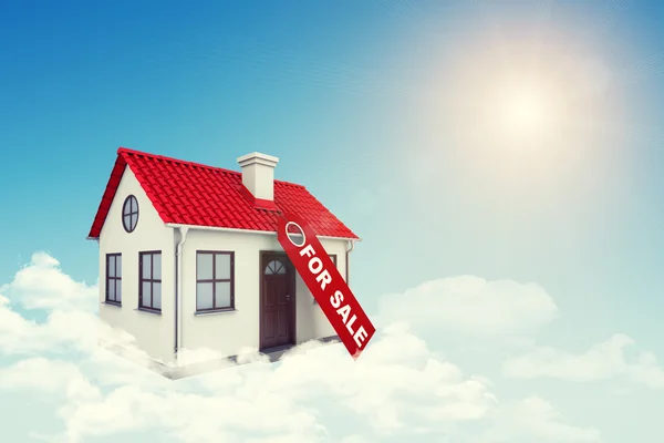 White house with label for sale, red roof and chimney in cloud. Background sun shines brightly