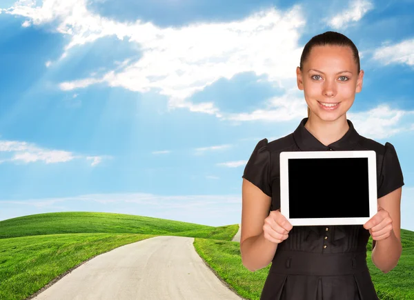 Young woman and landscape under blue sky