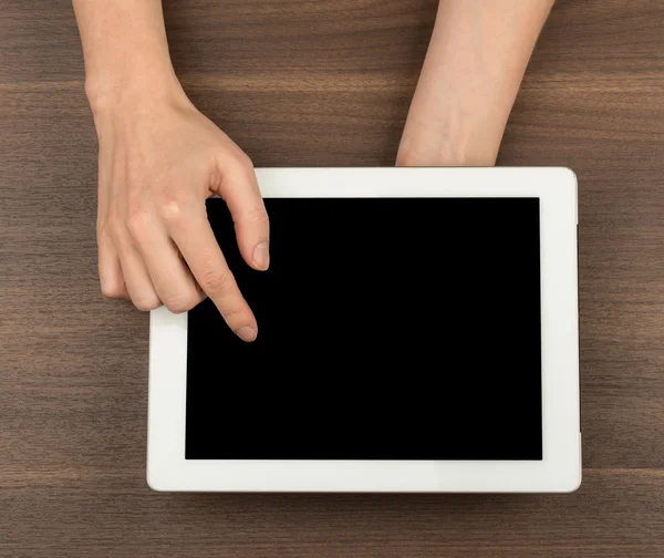 Humans hands pressing on tablet