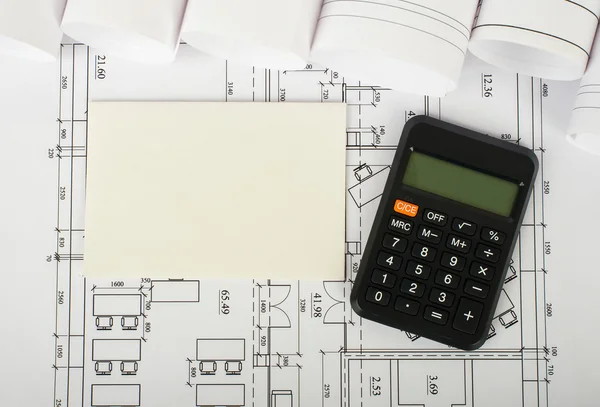 Blank card with calculator on blueprint