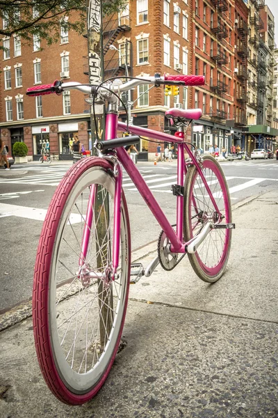 Pink bicycle on a street