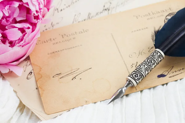 Quill pen and antique letters