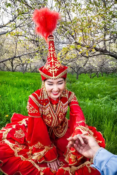 Woman in Kazakh costume with wedding ring