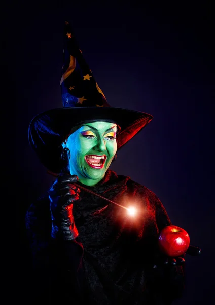 Wicked witch doing magic with her wand