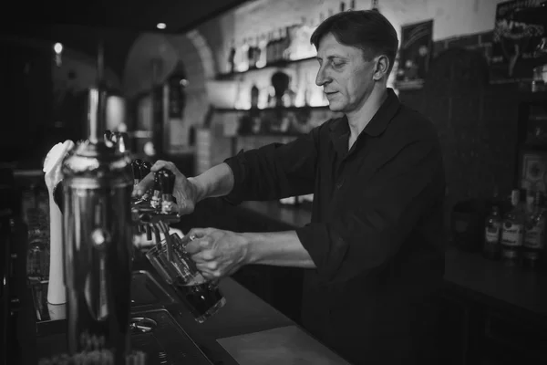 Barman at work in the pub