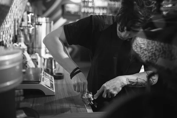 Barista at work in a coffee shop