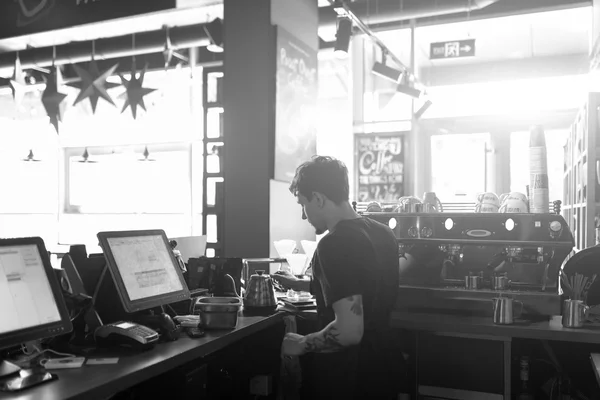 Barista at work in a coffee shop