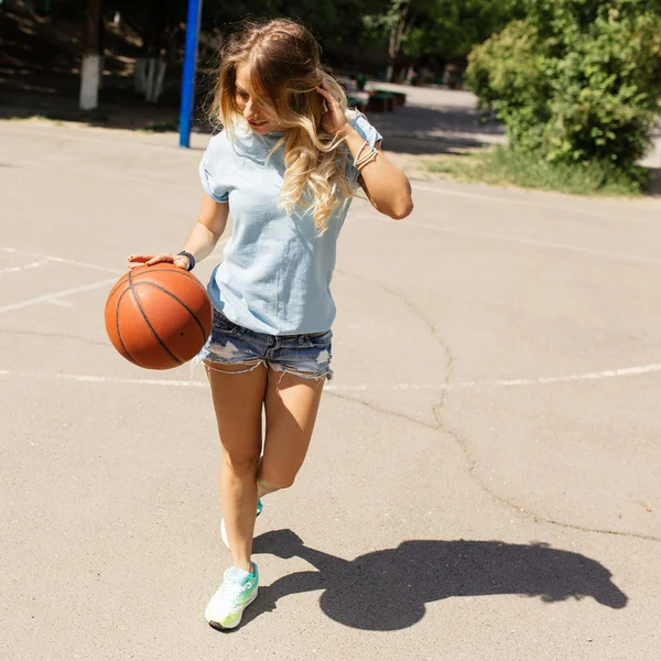 Sexy girl on the basketball court