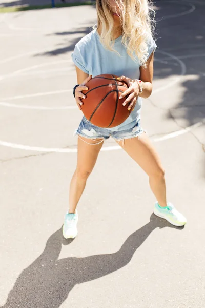 Sexy girl on the basketball court