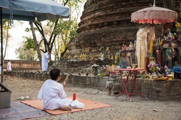 Buddhist pray in front of shrine