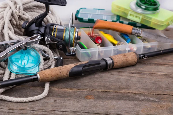 Fishing tackles and baits in storage boxes
