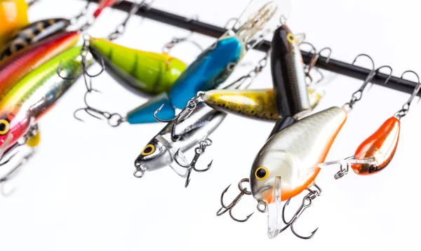 Colored fishing bait wobblers be suspended on rod`s blank