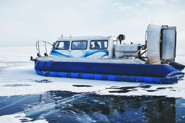 Hovercraft is on the pure ice of the frozen lake