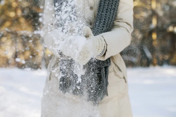 Girl throwing snow