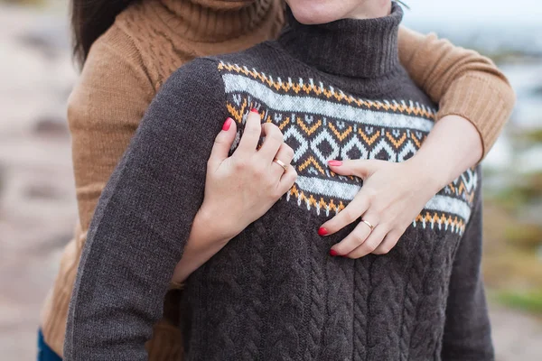 Female hands hugging man