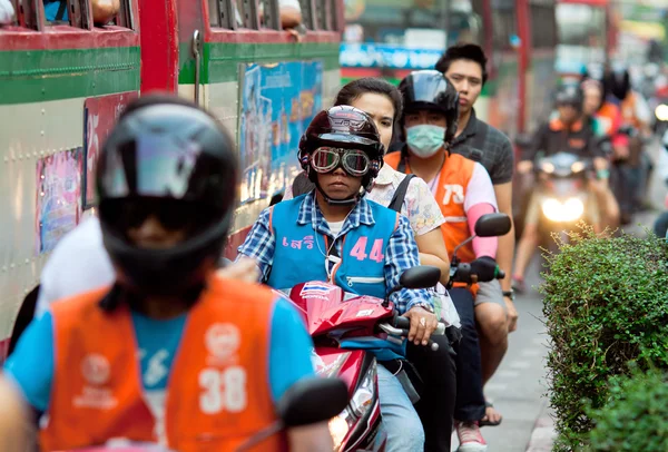 Several motorcycle taxi on the street Bangkok Thailand