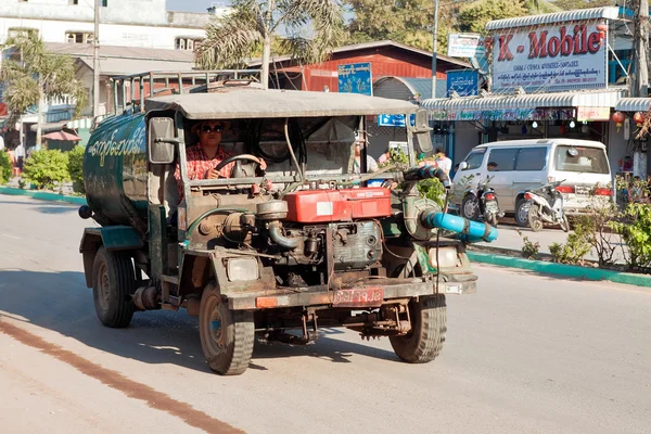 Truck communal water carrier service in Myawaddy carries water to clean streets before town festival