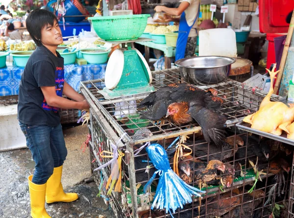 A street vendor chickens largest market Khlong Toey in Bangkok