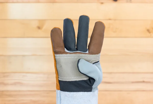 Hand in rough leather glove