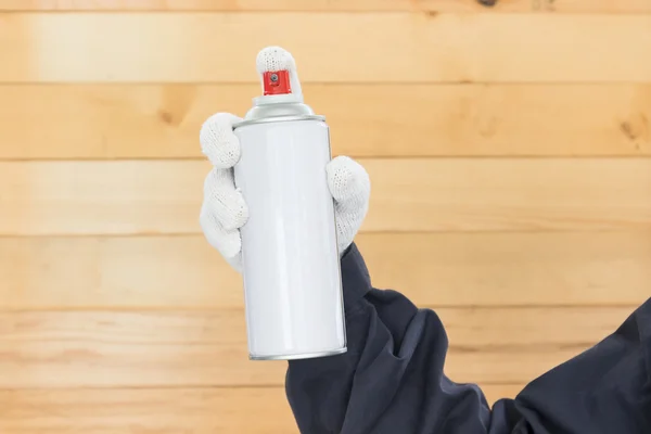 Hand holding spray paint can