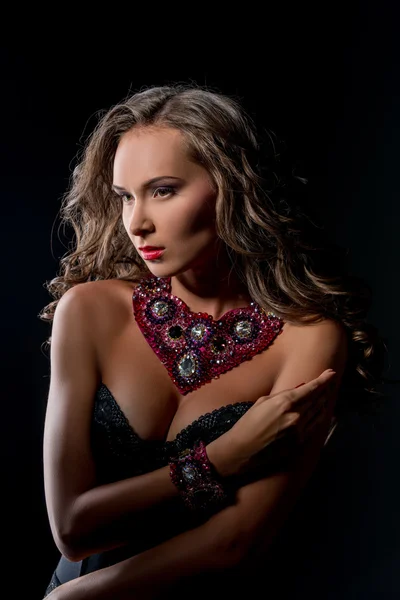 Luxury life and glamour. Pretty model touts jewels