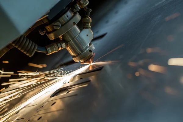 Laser cutting of metal sheet, close-up