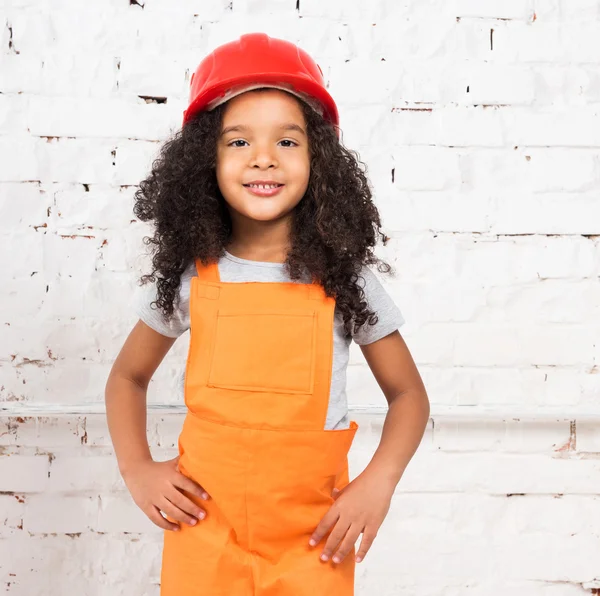 Little girl in orange repairmen uniform
