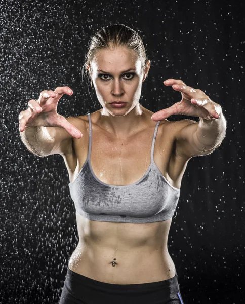 Athletic Woman Reaching her Hands Towards Camera