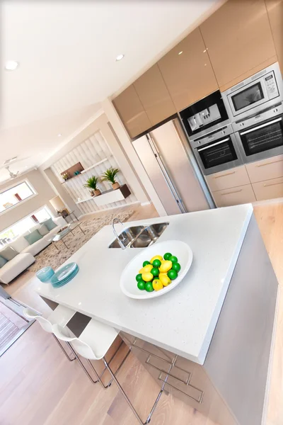 Modern kitchen interior and fruits on the table in a luxurious h