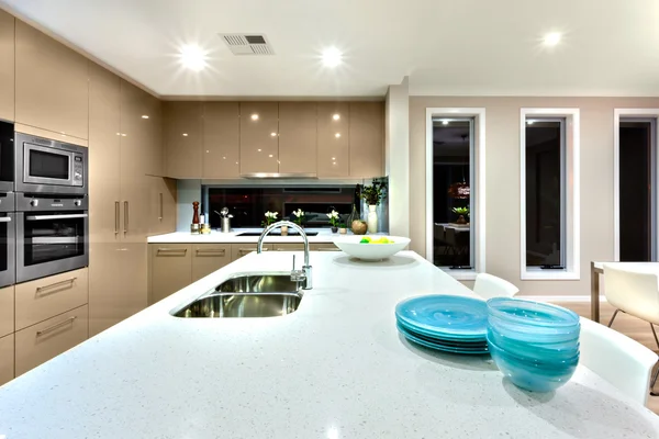 Close up of a white ceramic countertop in a modern kitchen inter