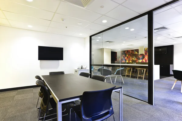 Modern meeting room with huge glass doors opened