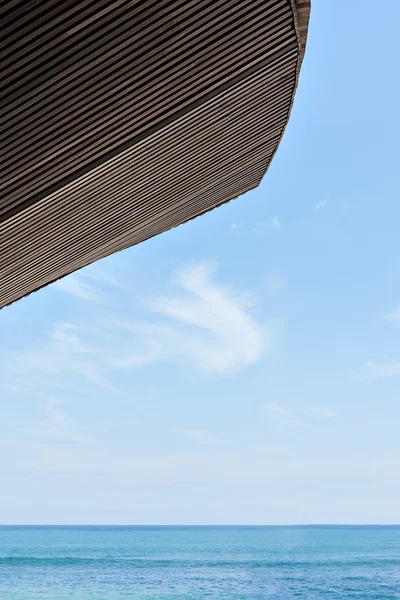 Sea side with horizon and blue sky and blue water