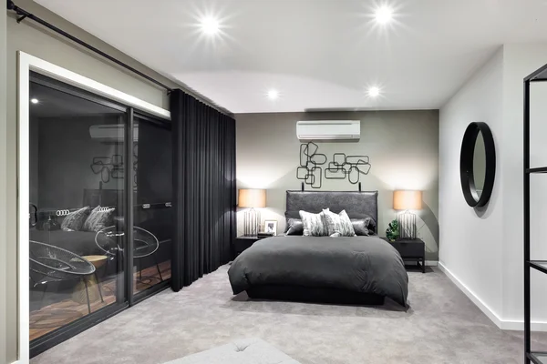 Black color bed in luxurious hotel with flashing lamps