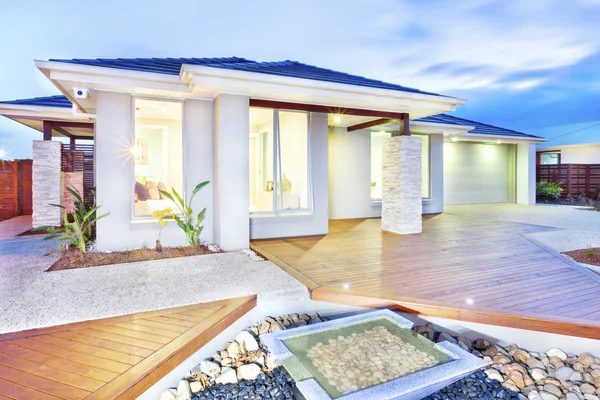 Modern mansion with wooden floor and concrete yard and stones