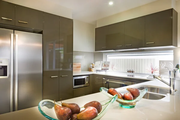 Stylish and modern picture of a kitchen with food placed on shel
