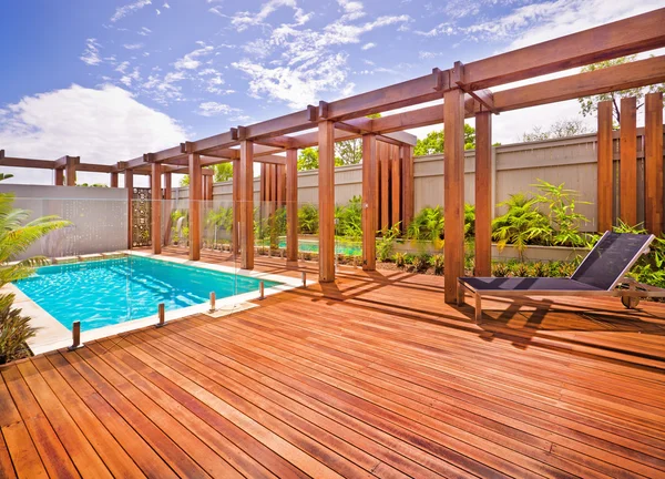 A beautiful view of pool in house in  a sunny day