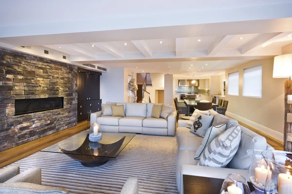 Cozy living room with a stone wall