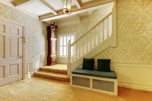Nice entry way to home with carpet staircase and interior