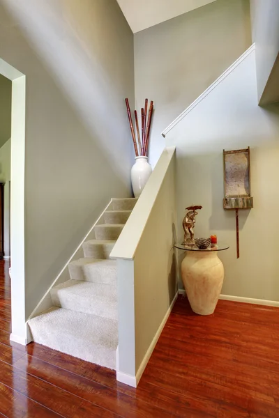 House interior. Staircase in the hallway with hardwood floor.