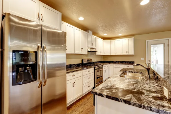 Kitchen room with white appliances, kitchen island