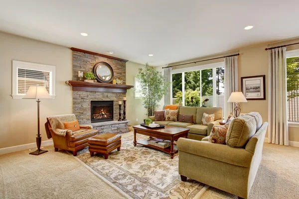 Spacious living room with fireplace, carpet floor and rug