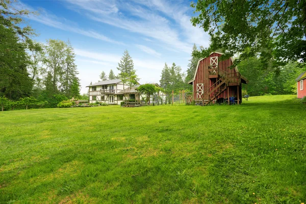 Home garden on backyard with red barn shed