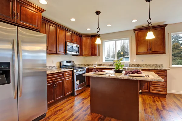 Kitchen with hardwood floor and granite counter tops.