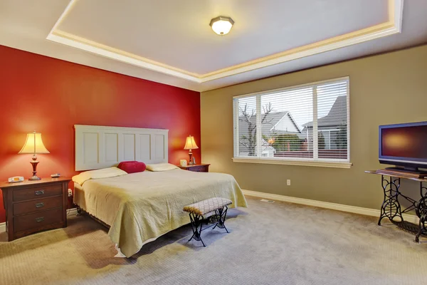 Red simple bedroom with big bed, large window.