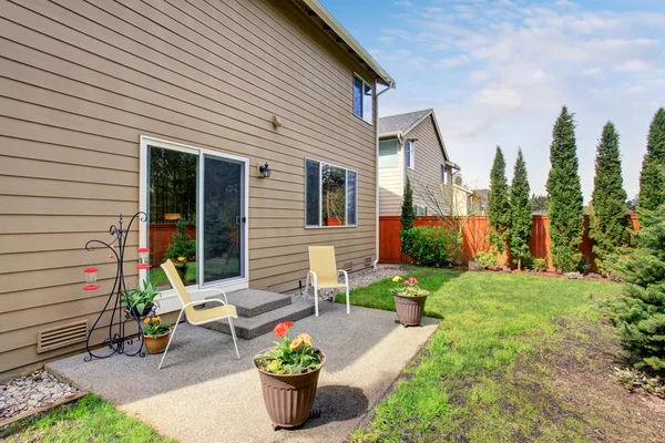 Nice backyard with concrete patio area.