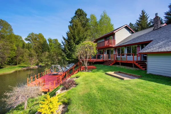 Backyard view of luxury red and blue American country house