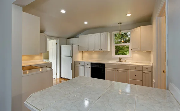 White empty simple old kitchen interior in American historical house.